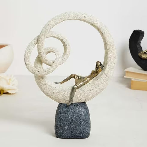 Modern leaning lady figurine