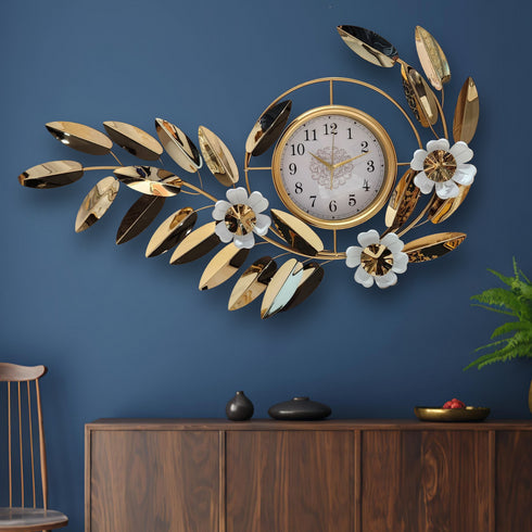 Golden leafy metal wall clock with white dial